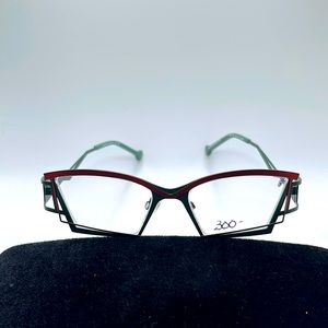 NWOT. Never Worn. Faniel of Paris orange and green metal frames.